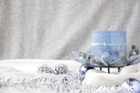 blue candle in winter seasonの写真素材