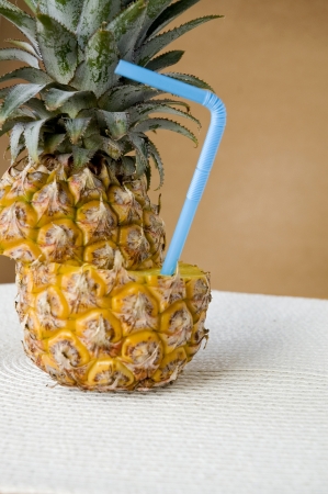 cut of fresh pineapple with straw for pineapple juice conceptの写真素材