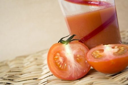 pieces of fresh tomato put with tomato juiceの写真素材