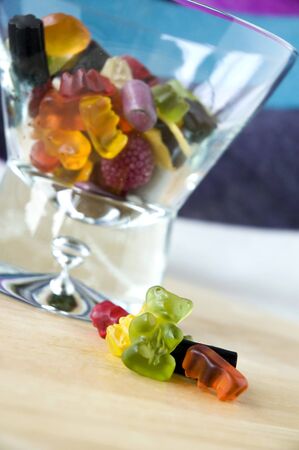 close up gummy bear with mix candy in glassの写真素材