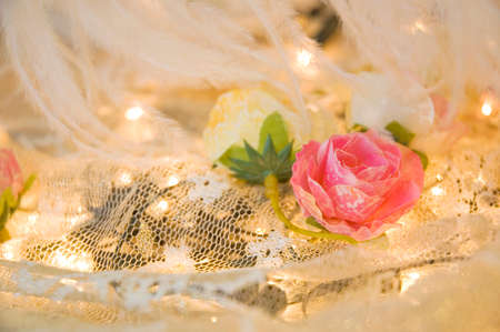 pink fabric roses put on laceの写真素材