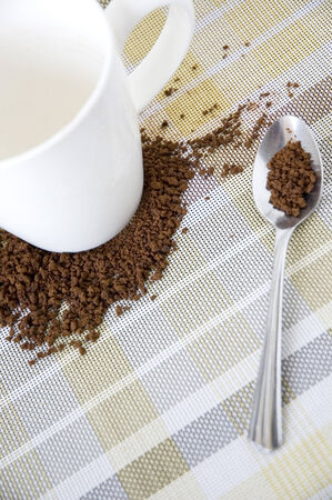 white cup put on instant coffee with spoonの写真素材