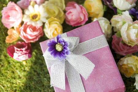 pink gift box with colorful flowersの写真素材