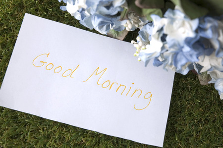 close up good morning on paper note with flowersの写真素材