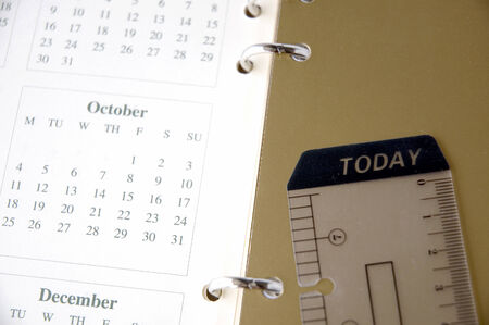 close up tag today on color background with monthly planner
