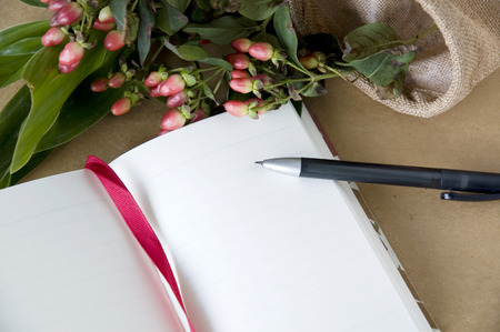 blank page notebook open with flowers backgroundの写真素材