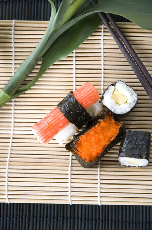 set of sushi put on bamboo matの写真素材