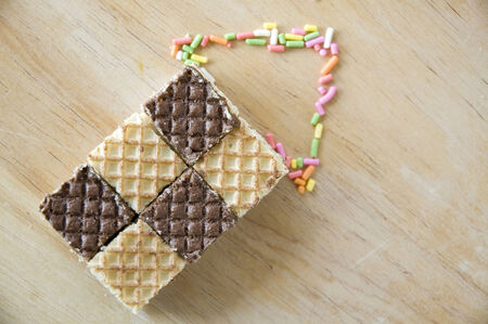 chocolate wafers point on wooden backgroundの写真素材