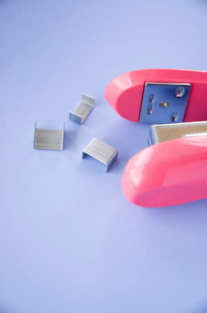 stapler office supplies put on blue backgroundの写真素材