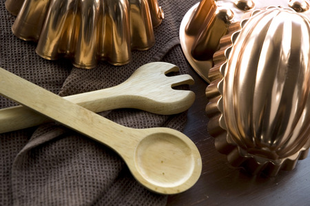 wooden spoon and copper molds kitchenware