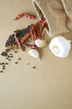spicy ingredients in sackcloth on backgroundの写真素材