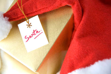 santa card on gift box with santa hat