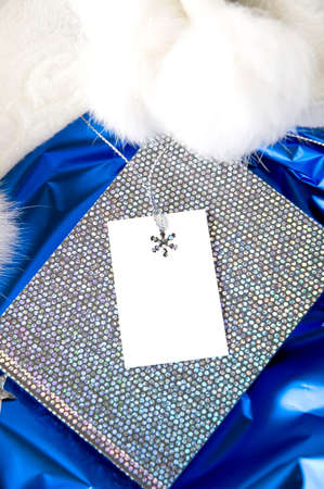 white gift card on silver and blue backgroundの写真素材