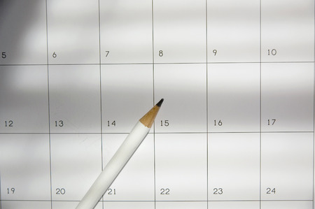 light and shadow on blank schedule with pencilの写真素材