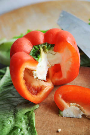 red bell pepper cutting on wooden cutting boardの写真素材
