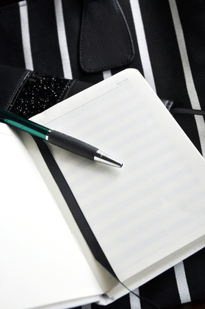 open blank notebook page with penの写真素材