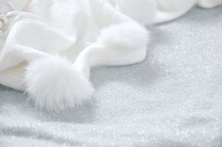 White puffy scarf on grey glitter backgroundの写真素材