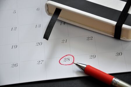 Red circle marked on date 28 on calendarの写真素材