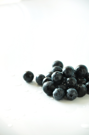 Close up group of fresh blueberries on white backgroundの写真素材