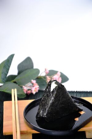 Onigiri Japanese rice ball serve on black plateの写真素材