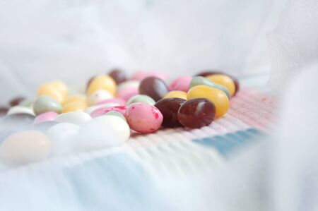 Close up colorful candies on soft white surrounding background