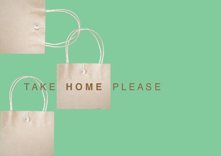 Paper bag for take home on pastel green backgroundの写真素材