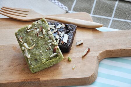 Clsoe up matcha green tea brownie on wooden board 