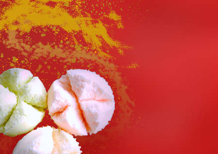 Colorful Chinese steam cake Fa Gao. The festive dessert for Chinese New Year on red and golden background with space for textの写真素材