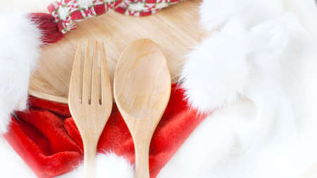 Wooden fork and spoon on Christmas concept background with copy spaceの写真素材