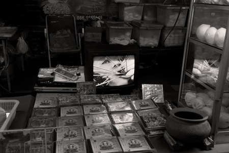 PHUKET, THAILAND - SEPTEMBER 26 2011: At the start of the annual Phuket Vegetarian Festival, an outdoor store in Phuket Town sells videos of a Ma Song (spirit medium) undergoing a ritual piercing.  のeditorial素材