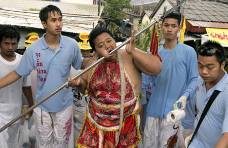PHUKET, THAILAND - OCTOBER 3 2011: A Ma Song (vessel of the gods) returns to the Jui Tui Chinese Temple at the end of a street procession during the annual Phuket Vegetarian Festival in Phuket Town.のeditorial素材