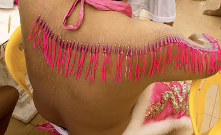 PHUKET, THAILAND OCTOBER 5 2011: A Mah Song (spirit medium) has his back pierced with ceremonial needles at Sui Boon Tang Chinese Shrine in Phuket Town during the annual Phuket Vegetarian Festival.のeditorial素材