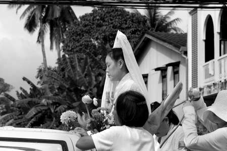 PHUKET, THAILAND OCTOBER 1 2013: A Ma Song carrying the spirit of Kuan Yin, Goddess of Mercy, rides through the streets of Phuket Town on a float during the annual Phuket Vegetarian Festival. のeditorial素材