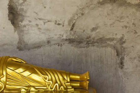 PHUKET, THAILAND FEBRUARY 15 2013: A reclining Buddha statue is one of many that encircle the base of the Big Buddha Monument, one of the most visited religious landmarks in Phuket.のeditorial素材