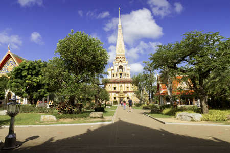 PHUKET, THAILAND MAY 15 2013: Tourists walk down a path that leads to the main stupa of Wat Chalong, the largest Buddhist Temple in the island province of Phuket. のeditorial素材