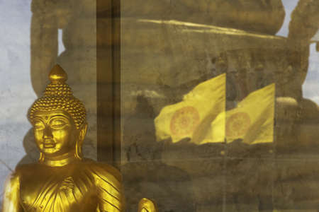 PHUKET THAILAND APRIL 4 2012: Aside from the Big Buddha, many Little Budda statues can be found at Big Budda Park, including a 22 meter high statue (reflection) dedicated to Thailand's Queen Sirikit.のeditorial素材