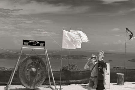PHUKET, THAILAND FEBRUARY 15 2013: A mother and her son stare up at the Big Buddha Statue as they walk around the base of the monument. のeditorial素材