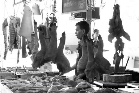 BANZAAN MARKET, PATONG, PHUKET, THAILAND MAY 18 2013: A vendor sells fresh pork at his stall inside the Banzaan Fresh Market in Patong Beach.のeditorial素材