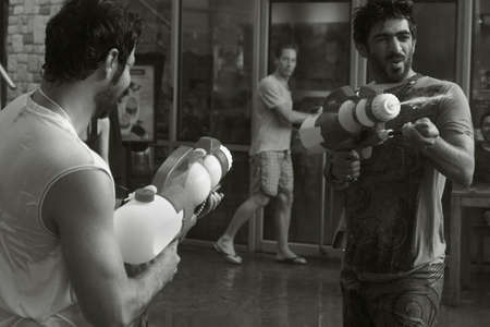 PATONG, PHUKET, THAILAND APRIL 13 2013: Two tourists duel it out with water guns during Songkran 2013 in Patong Beach.のeditorial素材