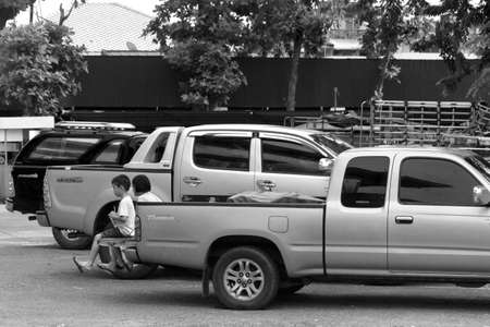 DOWNTOWN MARKET, PHUKET TOWN, PHUKET, THAILAND: SEPTEMBER 12 2012: Market stall vendors hang blankets as sunscreens to ward off the hot afternoon sun at Downtown Market in Phuket Town.のeditorial素材