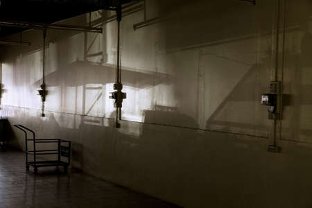 KATHU MARKET, KATHU, PHUKET, THAILAND MAY 13 2013: Market stall and umbrella shadow on wall of hallway interiorのeditorial素材