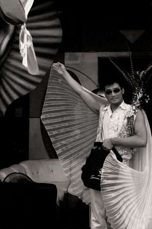 PATONG, PHUKET, THAILAND, 26 FEBRUARY 2011: After the conclusion of  the annual Patong Gay Pride Parade, a man continues the celebration at a post-parade celebration in Soi Paradise, the hub of gay culture and lifestyle in Patong.のeditorial素材