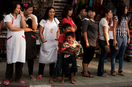PATONG, PHUKET, THAILAND, 26 FEBRUARY 2011: Patong Beach residents line the street to watch the annual Gay Pride Parade.のeditorial素材