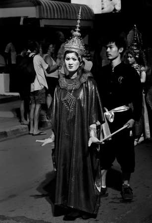 STREET FESTIVAL, PATONG BEACH, PHUKET, THAILAND, 15 DECEMBER 2013: A mime dressed in traditional Thai clothing performs during a street festival/parade in Patong Beach.のeditorial素材