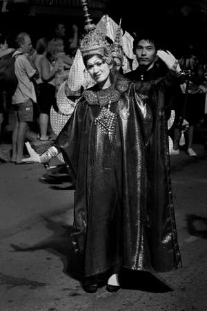 STREET FESTIVAL, PATONG BEACH, PHUKET, THAILAND, 15 DECEMBER 2013: A mime dressed in traditional Thai clothing performs during a street festival/parade in Patong Beach.のeditorial素材
