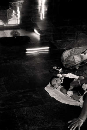 PENANG HILL HINDU TEMPLE, PENANG, MALAYSIA,  5 MAY 2014: An infant girl receives blessing in at the Sri Aruloli Thirumurugan Hindu temple on top of Penang Hill.のeditorial素材
