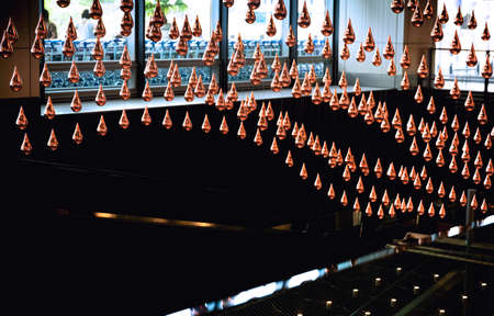 CHANGI AIRPORT, SINGAPORE, 20 MAY 2014:  Kinetic Rain, a large, moving kinetic art sculpture, is thelargest of its kind in the world and adorns the departure hall at Changi Airport in Singapore.のeditorial素材