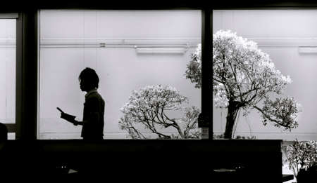 CHANGI AIRPORT, SINGAPORE, 20 MAY 2014: A waiter serves up a custonmer at an airport eatery in...
