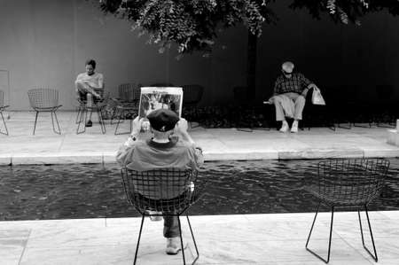 MUSEUM OF MODERN ART, NEW YORK CITY, USA, 27 JUNE 2010: Visitors relaxing in Sculpture Garden at...