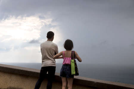 CAPE PROMTHEP, PHUKET, THAILAND, 30 NOVEMBER 2013: Couple enjoy view at Promthep Cape.のeditorial素材